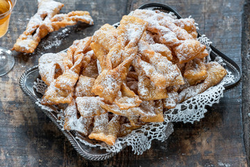Traditional Italian carnival fritters dusted with icing sugar - frappe or chiacchiere
