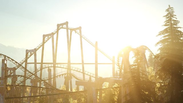 old roller coaster at sunset in forest
