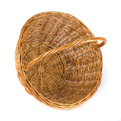 Fototapeta premium Empty wicker basket for fruits and vegetables, isolated on white