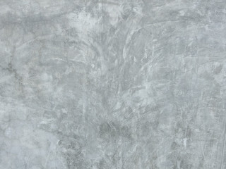 Natural exterior cracked pattern of gray cement wall for any design background.