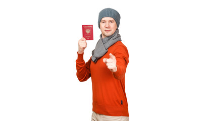 The Caucasian man with the international passport of the Russian Federation in warm clothes. Points a finger at the camera