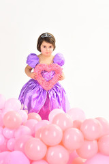 Party balloons. Happy birthday. Valentines day. Little girl princess. Kid fashion. Little miss in dress. Childhood happiness. Childrens day. Small pretty child hold heart. Best Valentines Day