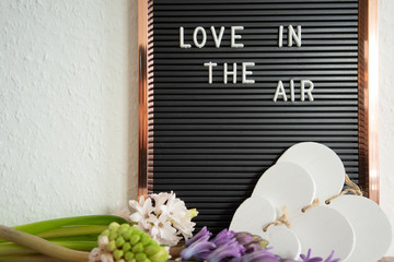 Love is in the air text on dark and white background, inscription, copy space