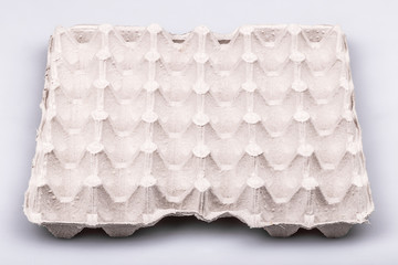 Empty cardboard for eggs on white background