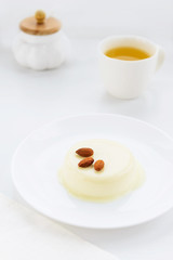 Panna cotta with almonds and a cup of green tea