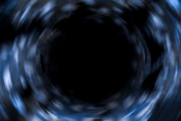 Blurred or defocused image of Dark blue cosmic vortex, portal background art, circle concept