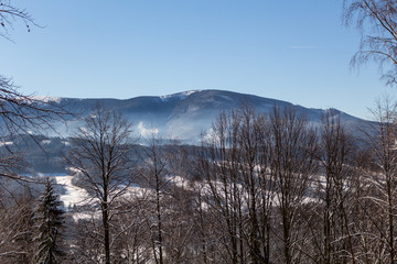 Majestic sunset in the winter mountains landscape. Dramatic sky.