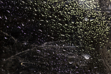 water drop on black . macro close up .raining glass isolated black background