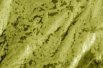 Wet plastic transparent old wrap texture in yellow tone.