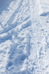 Fototapeta na wymiar tire tracks on snow