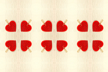 Abstract background of red hearts on light background mirror symmetry effect.