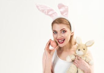 Egg hunt. Easter eggs as traditional food. Woman in rabbit bunny ears. happy woman in bunny ears with toy. Spring holiday. Girl with hare toy. Happy easter. copy space. Easter menu