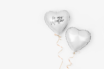 Air Balloons of heart shaped foil  on white background. Love concept. Holiday celebration....