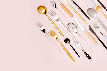 .Collection of various cutlery on pastel background, flat lay, top view,.