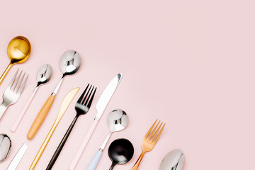 .Collection of various cutlery on pastel background, flat lay, top view,.