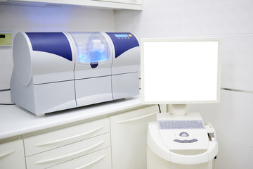 Wet milling and grinding machine and computer with intra oral scanner. Dentist’s office. Dental laboratory