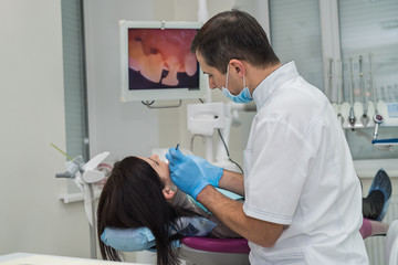 Patient and dentist looking at screen in dentistry