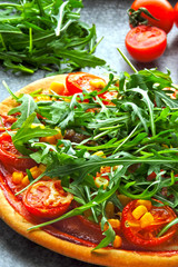 Vegan pizza with fresh arugula. Healthy food.