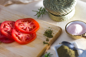 tomato slides on wooden board