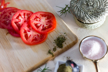 tomato slides on wooden board