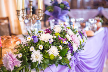 Purple and white wedding decoration with fresh flowers