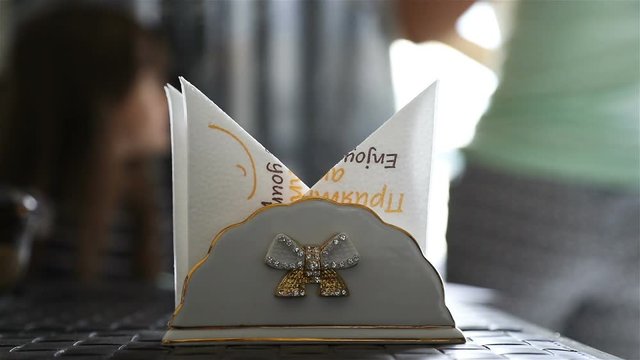 napkin holder decorated with rhinestones on the kitchen table in the morning.