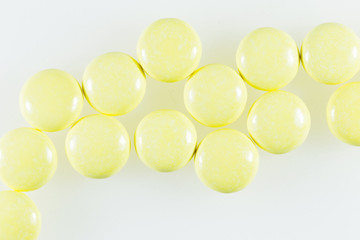 Yellow pill or capsule on background with copy space Prescription for medicines Medicines in healthy containers antibiotics on white background