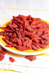 Healthy superfood, red dried goji chinese wolfberry berries, used in many snack foods and supplements, granola bars, yogurt, tea blends, fruit juice as whole berries or ground seeds, seed oil.