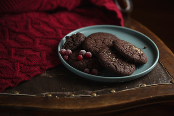 cookies with frozen cherries on the plate. Dark and Moody, Mystic Light food photography.