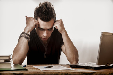 I hate my office work. Young businessman working in office. Low wages, overtime working hours, lack...