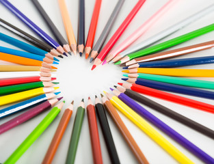 colored pencils lying around the heart