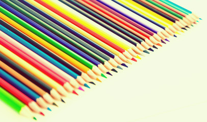 colored pencils lying in row