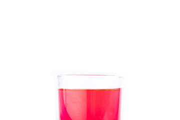 Glass of red water isolated on white background.
