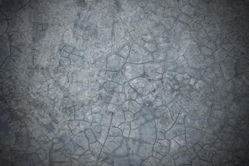 Cracked concrete texture closeup for background.