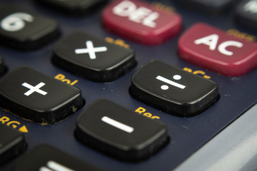 Closeup or macro photo of the scientific calculator buttons. Keys include the mathematical terms. Numerical operation concept.