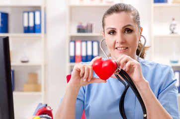 Female doctor cardiologist working in the clinic