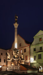 Fototapeta na wymiar Plague column at Concorde square (Namesti Svornosti) in Cesky Krumlov. Czech republic