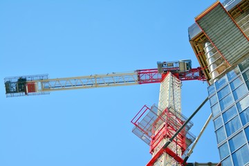 Naklejka premium Crane attached to building