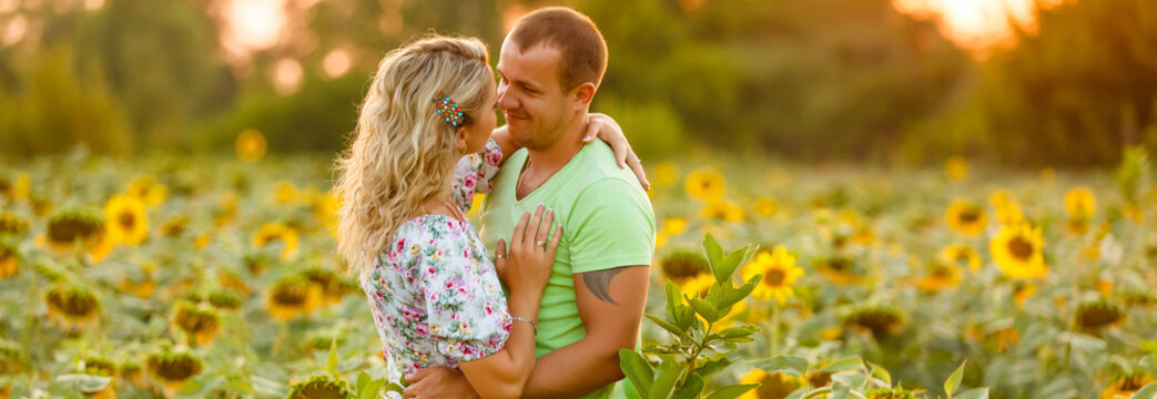 Romantic Couple on a Love Moment in a Sunflower field