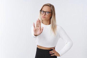 Stop right there. Upset displeased serious-looking powerful fai-haired businesswoman in glasses and...