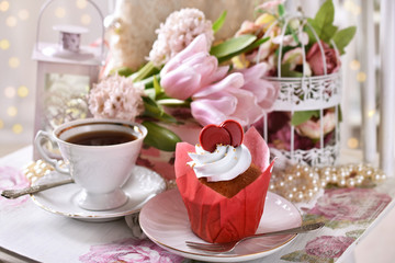 Obraz na płótnie Canvas a muffin and a coffee for Valentine's Day