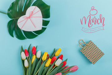 Spring tulips frame on background, top view. Postcard for Women's Day.