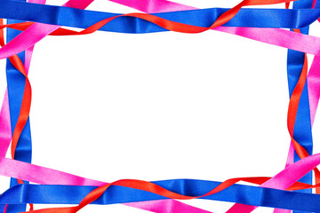Frame made from red, pink and blue satin ribbons isolated on white background with clipping path and copy space in the middle.