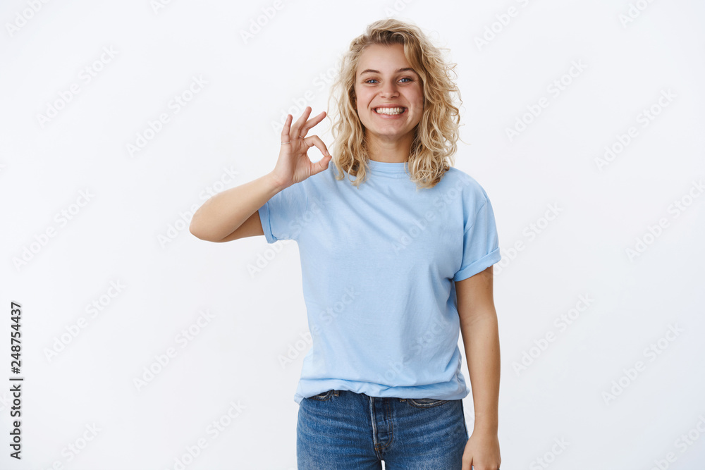 Wall mural Perfect, totally love it. Happy and pleased delighted female customer with blond short hairstyle and satisfied joyful grin showing okay gesture and smiling at camera reacting to excellent work