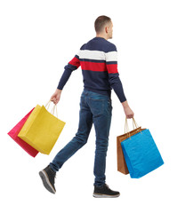 Side view of going man with shopping bags.