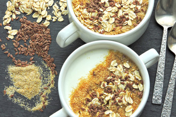 Healthy breakfast with white yogurt or kefir with flax seeds, oatmeal and bran. Superfood Fermented dairy products