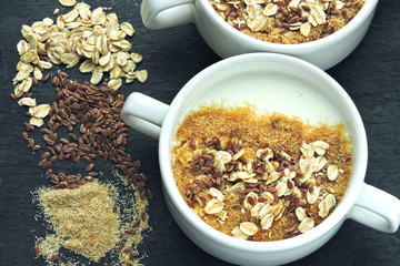 Healthy breakfast with white yogurt or kefir with flax seeds, oatmeal and bran. Superfood Fermented dairy products