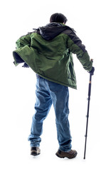 Mountain Climber or Hiker looking at a white background for composite.  The man is isolated and...