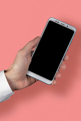 Man's hand holding mobile phone