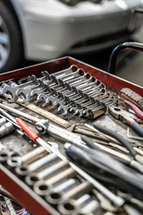 Tool box wagen. Toolset with wrenches, ring spanners, hammer, pliers, screwdrivers, monkey wrenches, screws, bolts, wire and other do-it-yourself (DIY) tools. Car Repair
